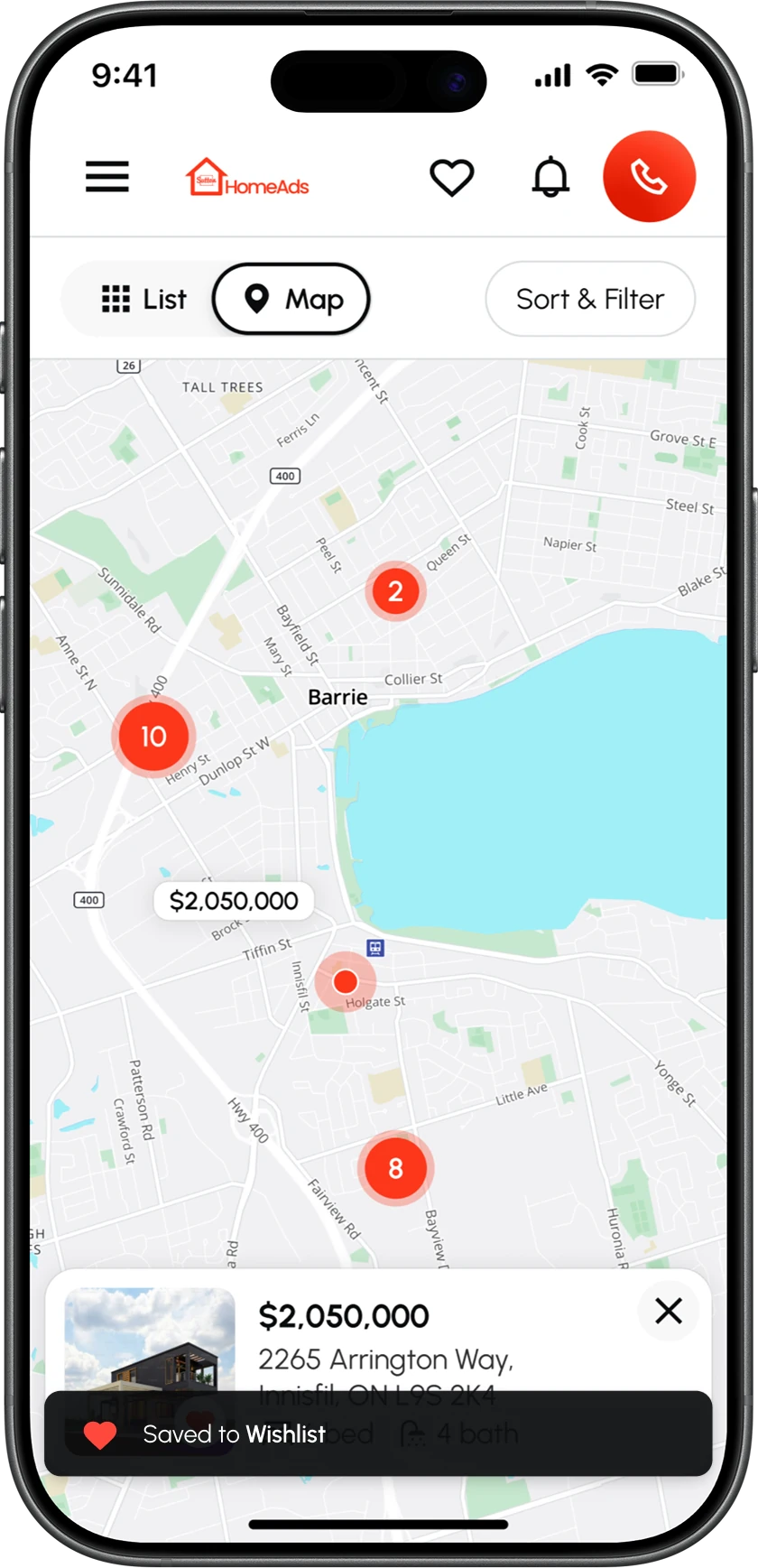 The map view on a phone, with the Saved to Wishlist toast over the selected listing.